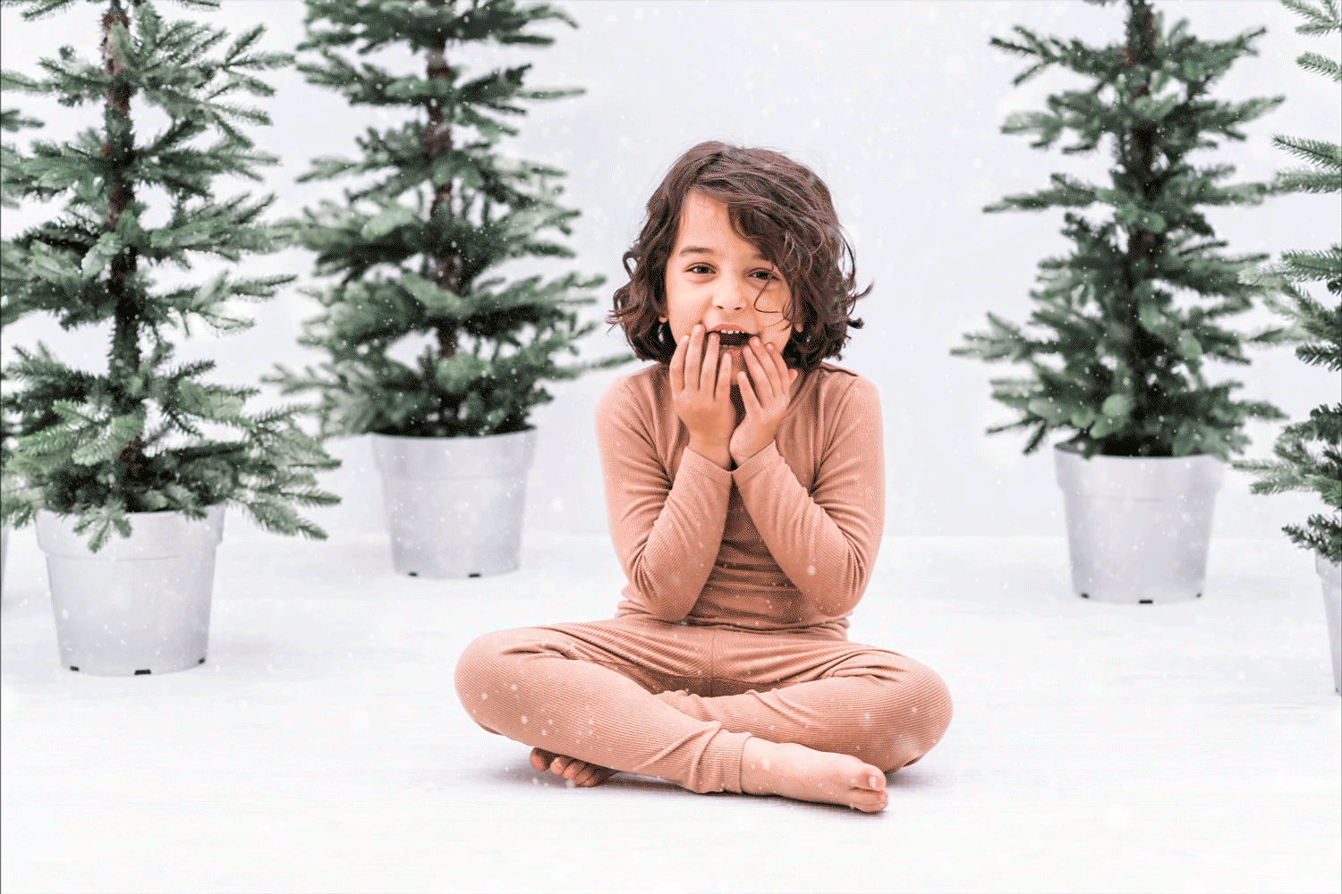 GIF of happy kid with falling snow at Meg Sivakumar 2020 Holiday Mini Session